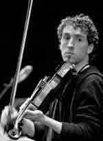 Colm Mac Con Iomaire comfortable plays banjo, guitar, piano, electronic keyboards and fiddle